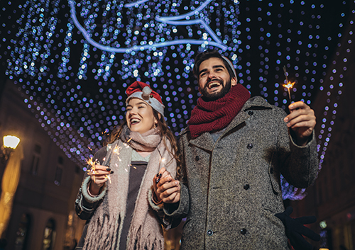 A couple celebrating the New Year outside.