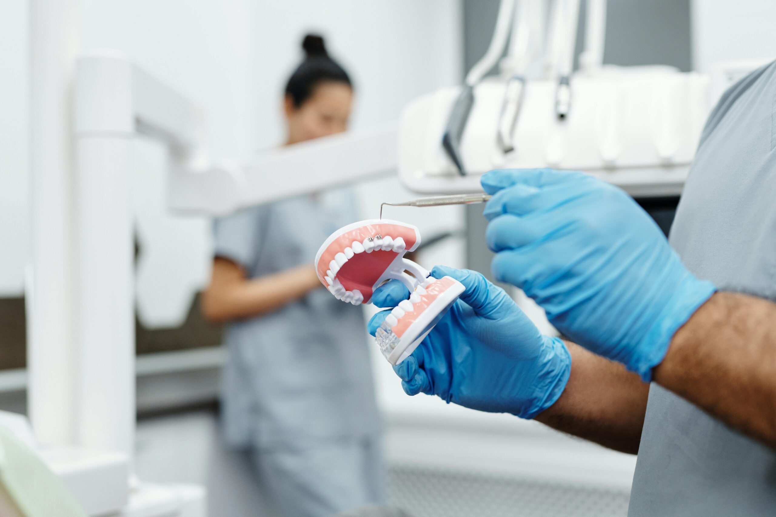 Teen holding mouth in discomfort due to braces issue