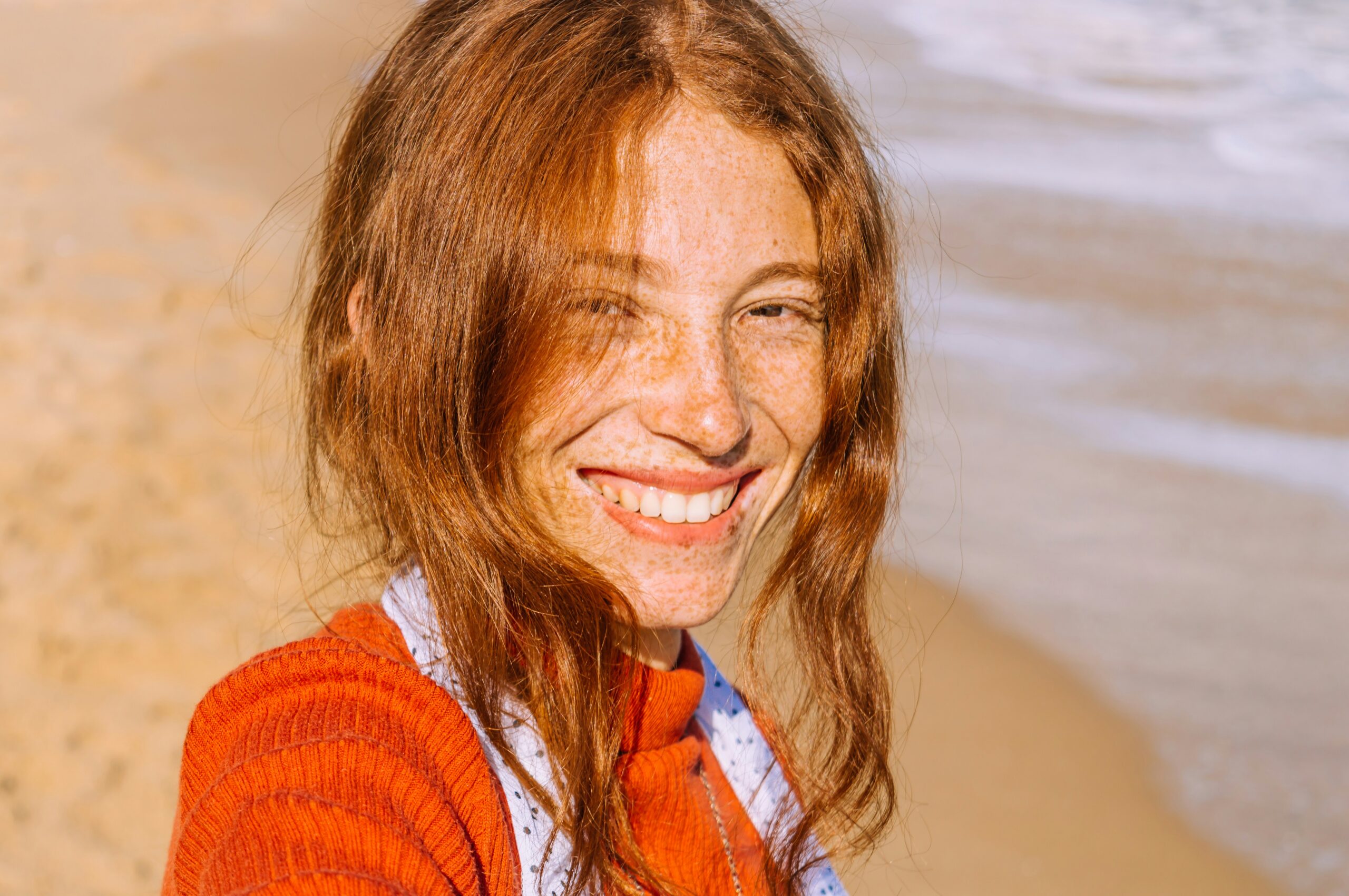 Confident young woman displaying beautiful natural smile, showcasing the results of quality orthodontic care